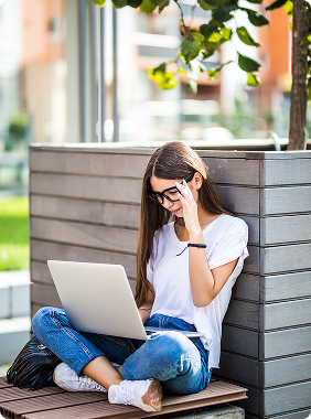 Student using laptop outside